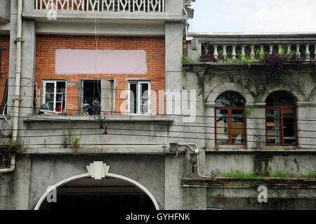 Very old and weathered buildings in the city of Guangzhou China in Guangdong province. Stock Photo