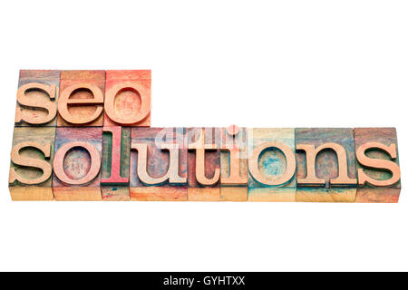 SEO solutions banner in letterpress wood type printing blocks isolated on white Stock Photo