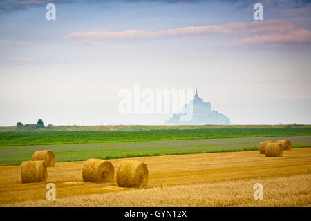 St Michael´s Mount and farm land with wheat bales, Manche Department, Basse-Normandie region, Normandy, France, Europe