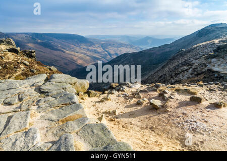 Dark Peak in Winter. Sunlight breaking through clouds at the head of Grindsbrook Clough, Kinder Scout, Derbyshire, Peak District, England, UK Stock Photo