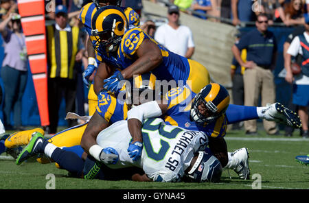 Los Angeles, California, USA. 18th Sep, 2016. Los Angeles Rams defensive end Eugene Sims (97) tackles Seattle Seahawks running back Christine Michael (32) for a loss of yards in the second half of a NFL football game at the Los Angeles Memorial Coliseum on Sunday, Sept. 18, 2016 in Los Angeles. Los Angeles Rams won 9-3. (Photo by Keith Birmingham, Pasadena Star-News/SCNG) Credit:  San Gabriel Valley Tribune/ZUMA Wire/Alamy Live News Stock Photo