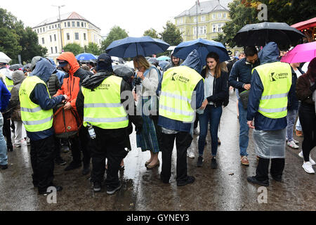 Munich, Germany. 18th Sep, 2016. Stewards at the entrance to the Wiesn - the Oktoberfest site - in Munich, Germany, 18 September 2016. The 183rd Oktoberfest runs from 17 September - 3 October 2016. PHOTO: FELIX HOERHAGER/DPA/Alamy Live News Stock Photo