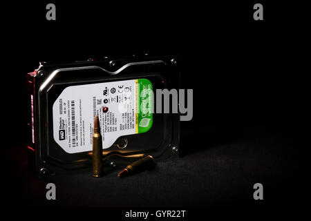 Western Digital Hard Drive with 5.56mm Bullet Hole Stock Photo