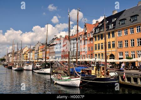 Sailing boats on the canal in front of colorful facades, Nyhavn, Copenhagen, Denmark Stock Photo