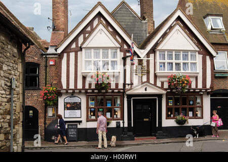 People outside The King Charles pub 1770 an 18th century half timbered inn in the old town. Poole, Dorset, England, UK, Britain Stock Photo