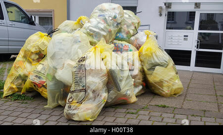 Yellow bags full of plastic waste Stock Photo - Alamy