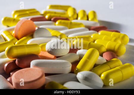 Stack of different colorful pills Stock Photo