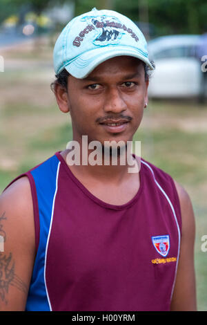 WELIGAMA, SRI LANKA - MARCH 7, 2014: Portrait of young local fisherman. Tourism and fishing are two main business in this town. Stock Photo