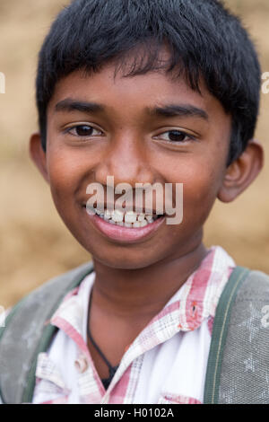 ELLA, SRI LANKA - MARCH 2, 2014: Portrait of local boy posing on tea plantation. Ella is famous for the tea plantations and stun Stock Photo