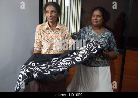 COLOMBO, SRI LANKA - MARCH 12, 2014: Local women in batik workshop. The manufacture and export of textile products is one of the Stock Photo