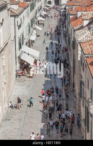 DUBROVNIK, CROATIA - MAY 26, 2014: Crowds walking down Stradun in the old town Dubrovnik, Croatia. Stock Photo