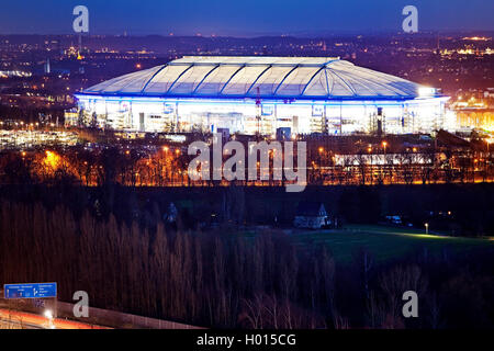 illuminated football stadium Veltins-Arena in twilight, Germany, North Rhine-Westphalia, Ruhr Area, Gelsenkirchen Stock Photo