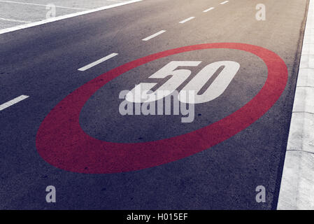 50 kmph or mph driving speed limit sign on highway, road safety and preventing traffic accident concept. Stock Photo