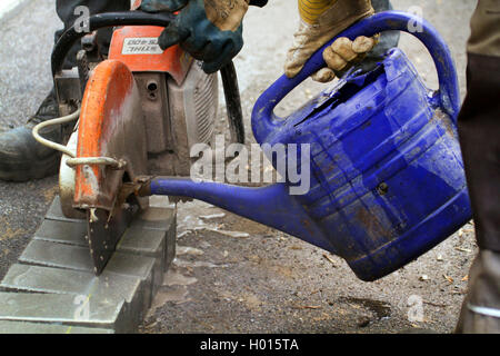 cutting paving blocks with angle grinder Stock Photo