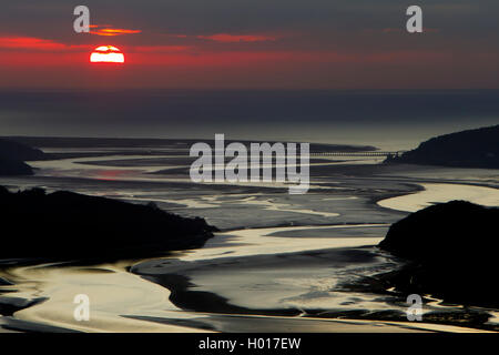 Sunsetting over Cardigan Bay looking down the Mawddach Estuary towards Barmouth Bridge Stock Photo