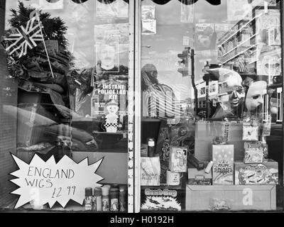 Window reflections in an English joke shop. Stock Photo
