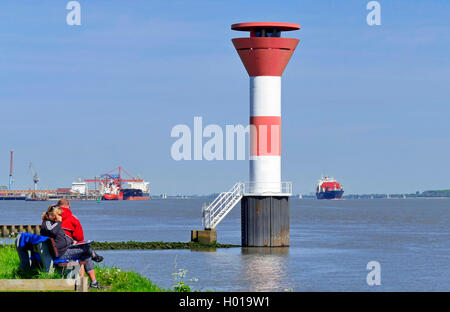 leading lights Buetzeflether Sand, container ship in background, Germany, Lower Saxony, Elbe, Stade Stock Photo