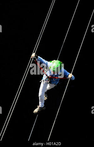 climber crossing a simple suspension bridge, Via ferrata de Tende voie du chateau des Comtes Lascaris, France, Alpes Maritimes, Tende Stock Photo