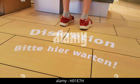 projection on the floor 'discretion, please wait here!', Germany Stock Photo