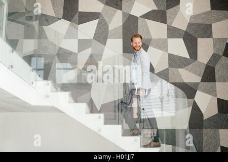 Businessman taking the stairs living a dynamic life Stock Photo