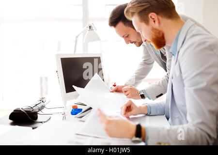 Colleagues working in office and brainstorming Stock Photo