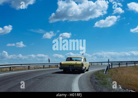An old timer American car on a highway in Sweden Stock Photo