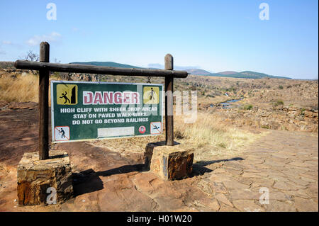 Information board indicating a dangerous area (High cliff with sheer drop) and to stay on the paved walk-ways, South Africa Stock Photo
