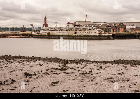 A view across the River Tees to Middlehaven from Port Clarence showing an old ship and the clock tower Stock Photo