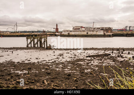 A view across the River Tees to Middlehaven from Port Clarence including Temenos,clock tower,old ship and wooden jetty Stock Photo