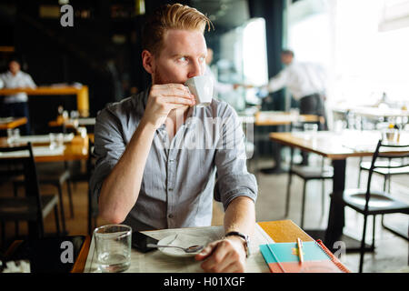 Businessman enjoying coffee during break Stock Photo