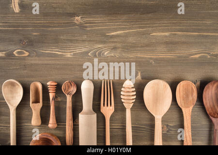 Various wooden kitchen utensils on table Stock Photo