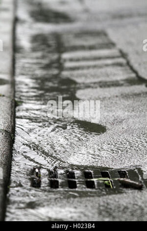 rainwater draining off in a gully, Germany Stock Photo