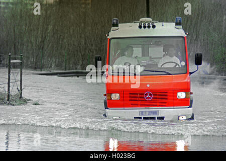 ambulance vehicle passing through high water, Germany, North Rhine-Westphalia