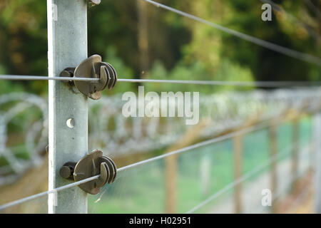 Electrified security fence Good depth selective focus image. Stock Photo