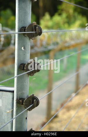 Electrified security fence Good depth selective focus image. Stock Photo