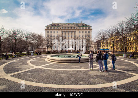 ZAGREB, CROATIA - 17 MARCH 2015: A side view of the main entrance to the Esplanade Hotel in Zagreb from a park with a fountain w Stock Photo