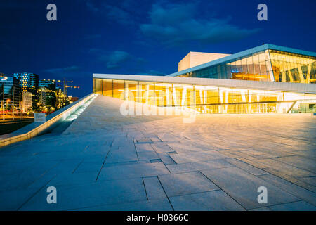 Oslo, Norway - July 31, 2014: The Side View Of Brightly Illuminated Glass Facade Of Norwegian National Opera And Ballet House In Stock Photo