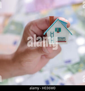 small house in man hand Stock Photo