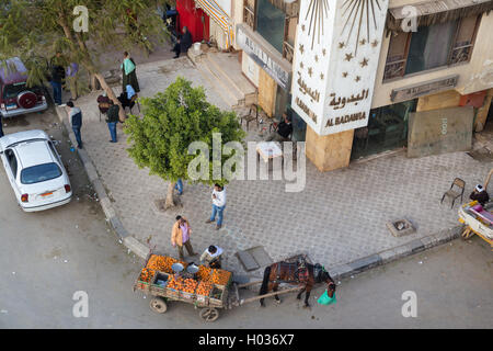 CAIRO, EGYPT - FEBRUARY 2, 2016: Aerial view of street corner with horse cart oranges vendor. Stock Photo