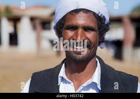 DARAW, EGYPT - FEBRUARY 6, 2016: Portrait of local camel salesman with turban. Stock Photo