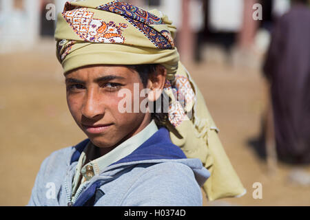DARAW, EGYPT - FEBRUARY 6, 2016: Portrait of local boy with head scarf. Stock Photo