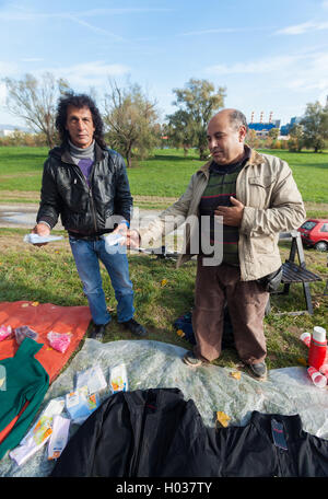 ZAGREB, CROATIA - OCTOBER 20, 2013: Salesmen at Zagreb's flea market Hrelic. Stock Photo