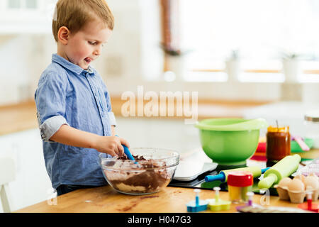 Cute child learning to become a chef  since the age of 2 Stock Photo