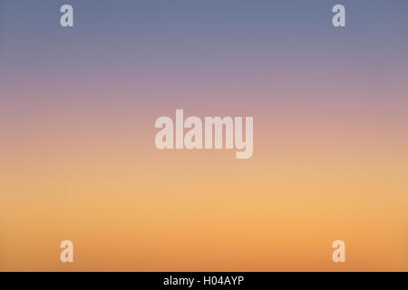 photo of orange and blue sunset sky gradient background Stock Photo