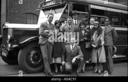 Well dressed group people meeting in Southampton to board coach bus to London in 1934