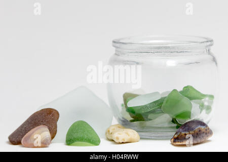 Sea glass and shells in jar Stock Photo