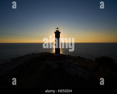 Lighthouse at sunset  in Veli Rat in Croatia Stock Photo