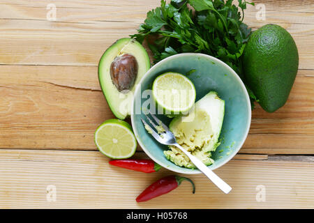 dip of avocado guacamole and corn chips, Mexican food Stock Photo