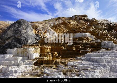 Travertine deposits from hot springs, lower terraces at Mammoth Hot Springs, Yellowstone National Park Stock Photo