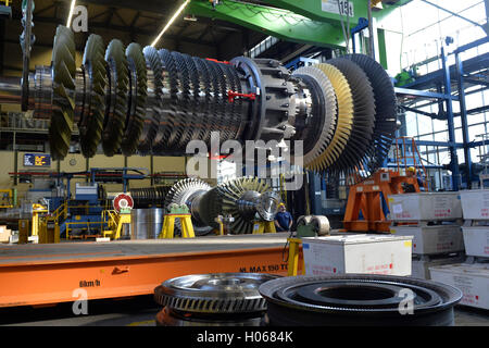 Siemens workers monitor a turbine rotor in a gas turbine in Berlin ...